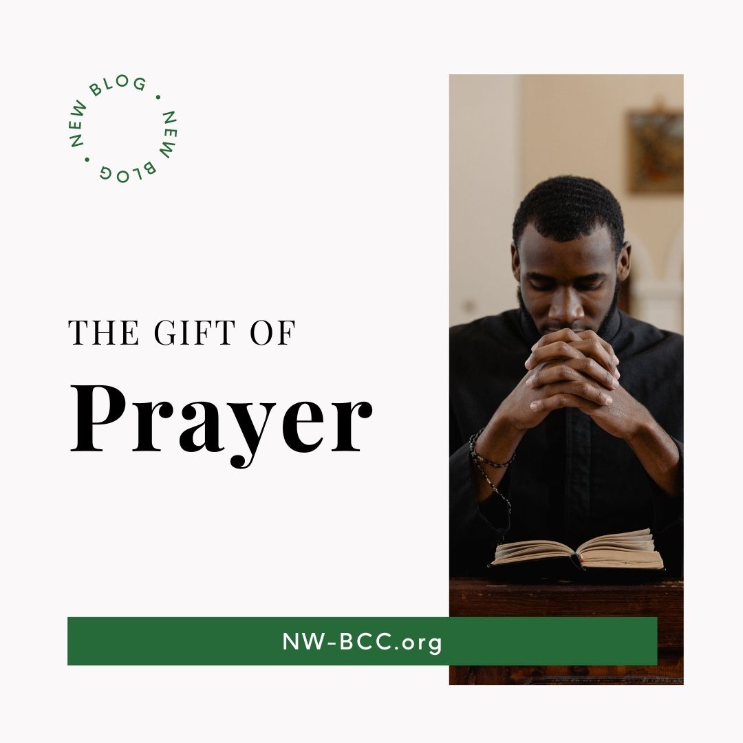 New blog post titled "The Gift of Prayer" with photo of black man sitting in pew at church praying.