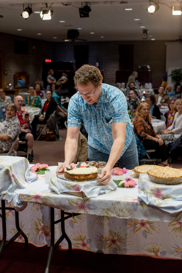 Man taking a dessert from the table