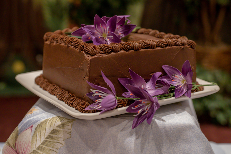 Chocolate cake with purple hawaiian flowers