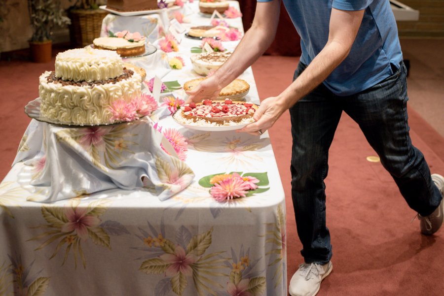 Man taking a dessert from the table